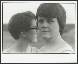 close-up portrait of two {white?} middle-aged women.